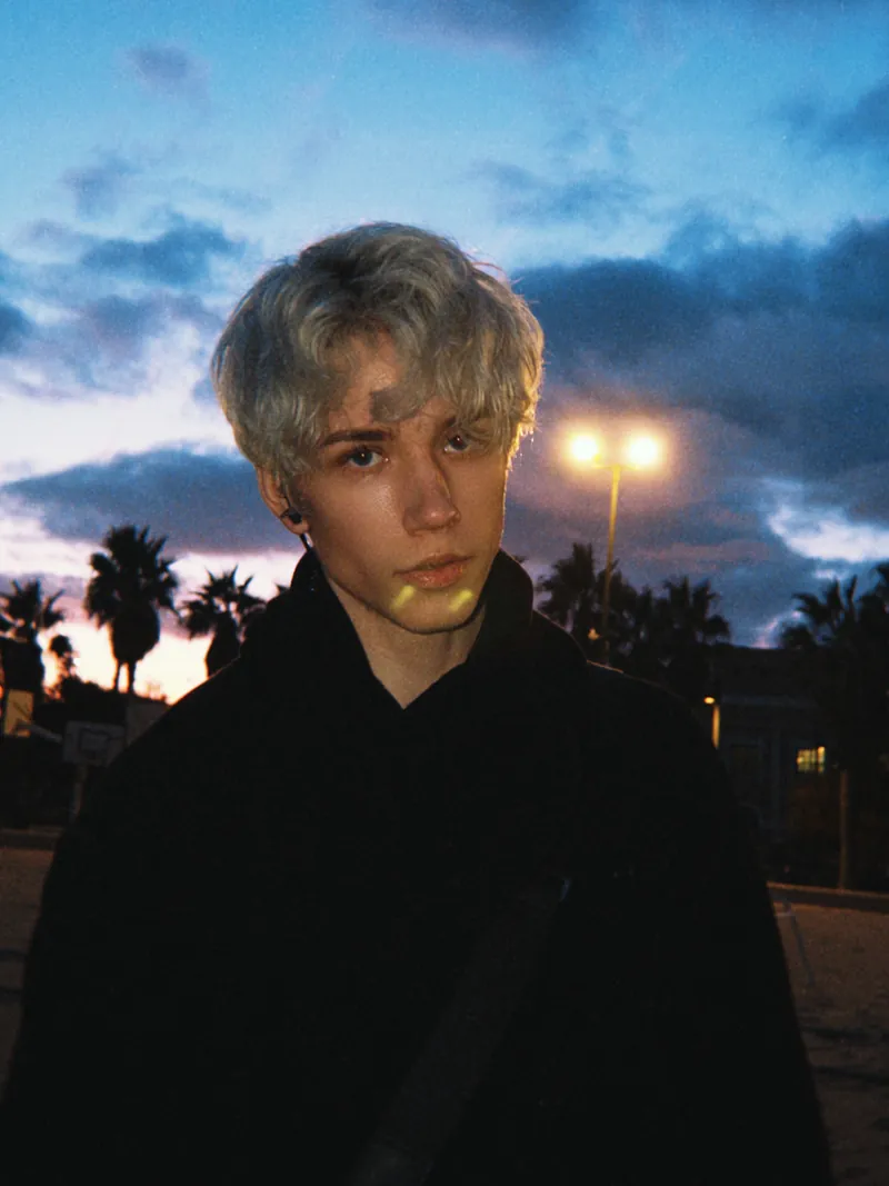Dom at dusk beneath palm trees